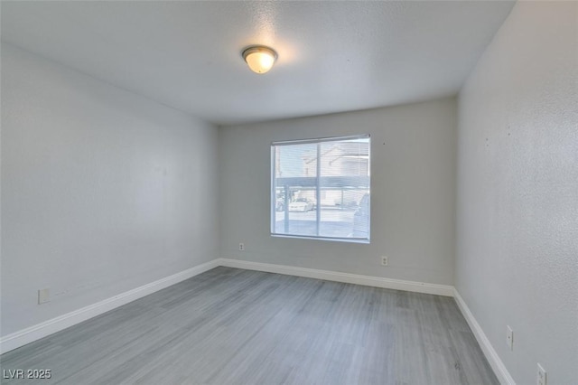 1550 Jamielinn Ln Unit 102, Las Vegas, NV 89110 - empty room with wood finished floors and baseboards