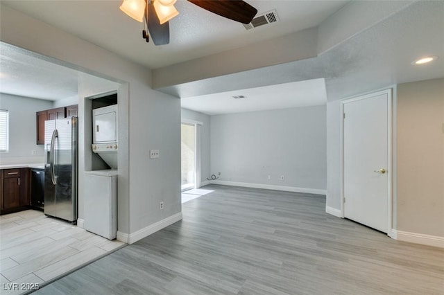 1550 Jamielinn Ln Unit 102, Las Vegas, NV 89110 - unfurnished room featuring estacked washer and dryer, a ceiling fan, light wood-type flooring, baseboards, and recessed lighting