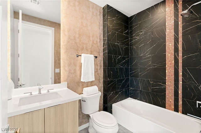 bathroom featuring shower / washtub combination, visible vents, vanity, and toilet