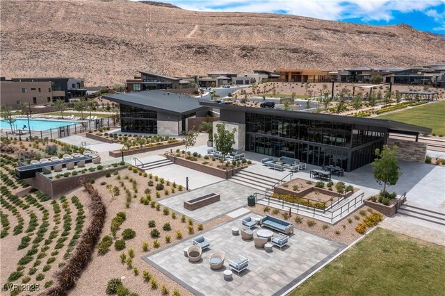 birds eye view of property with a mountain view