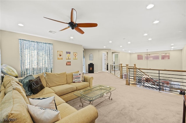 living room featuring a ceiling fan, visible vents, carpet, and recessed lighting