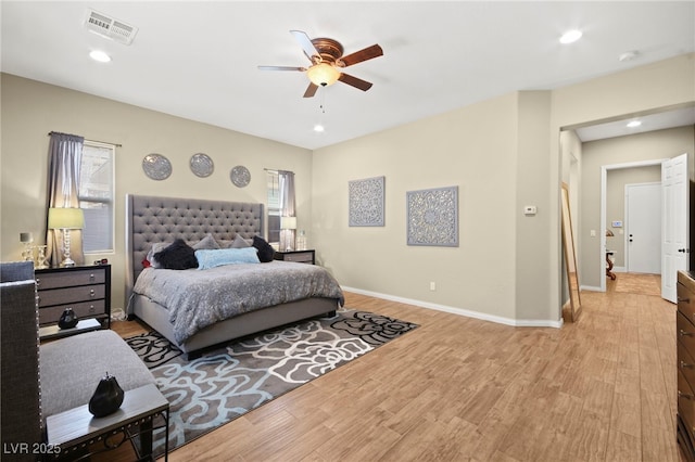 bedroom featuring recessed lighting, visible vents, light wood-style floors, baseboards, and ceiling fan
