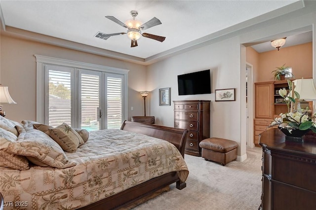 bedroom with access to exterior, visible vents, baseboards, light colored carpet, and ceiling fan