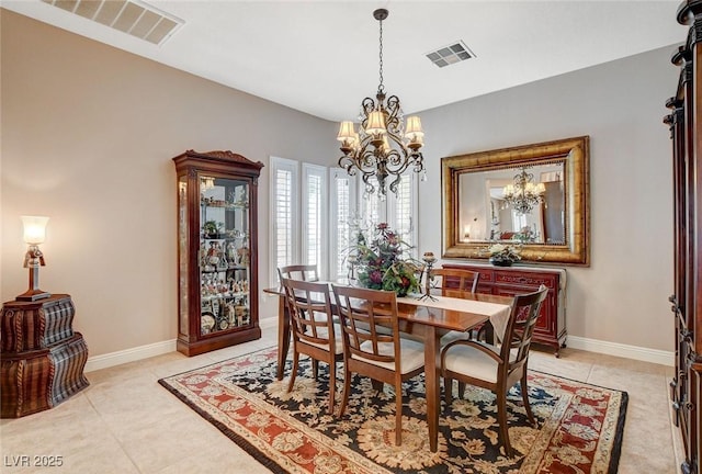 dining room with baseboards, visible vents, light tile patterned floors, and an inviting chandelier