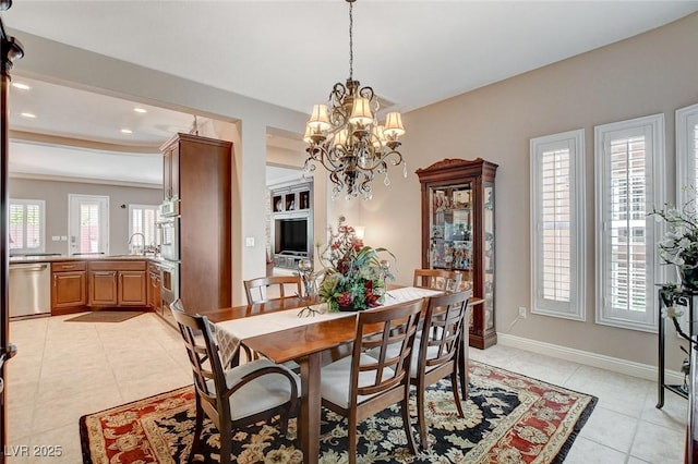 dining area featuring light tile patterned floors, baseboards, a notable chandelier, and recessed lighting