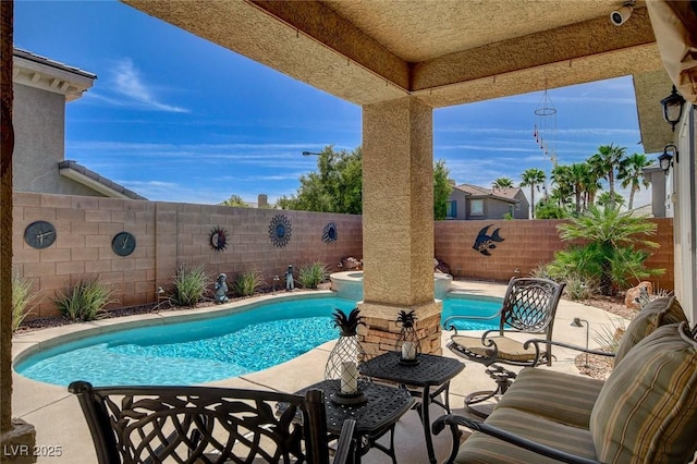 view of swimming pool with a fenced in pool, a patio, and a fenced backyard