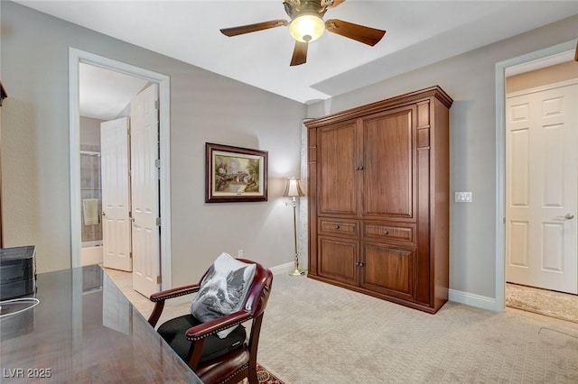 home office featuring baseboards, light colored carpet, and ceiling fan