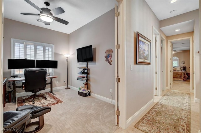 carpeted office space featuring ceiling fan, baseboards, visible vents, and recessed lighting