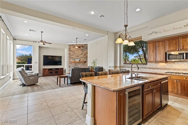 4624 Leon De Oro Dr, Las Vegas, NV 89129 - kitchen featuring wine cooler, appliances with stainless steel finishes, a sink, light tile patterned flooring, and recessed lighting