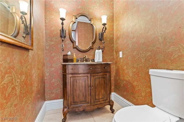 4624 Leon De Oro Dr, Las Vegas, NV 89129 - bathroom featuring toilet, wallpapered walls, baseboards, tile patterned flooring, and vanity