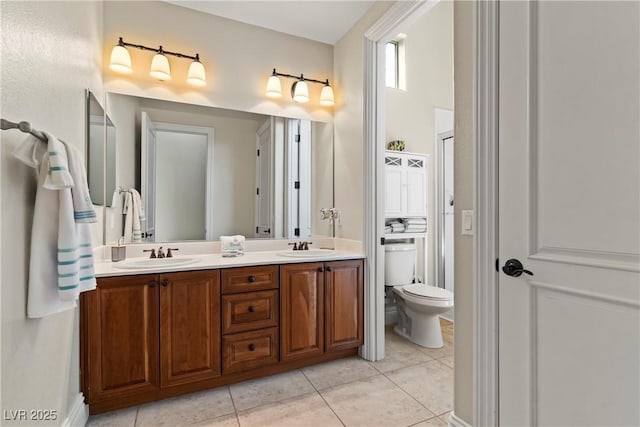 4624 Leon De Oro Dr, Las Vegas, NV 89129 - bathroom featuring double vanity, tile patterned floors, and toilet