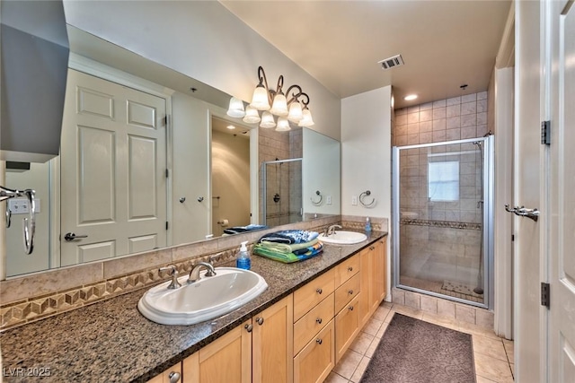 2405 W Serene Ave Unit 703, Las Vegas, NV 89123 - bathroom featuring tile patterned flooring, visible vents, a sink, and a shower stall