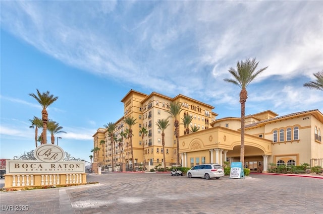 2405 W Serene Ave Unit 703, Las Vegas, NV 89123 - view of building exterior featuring uncovered parking