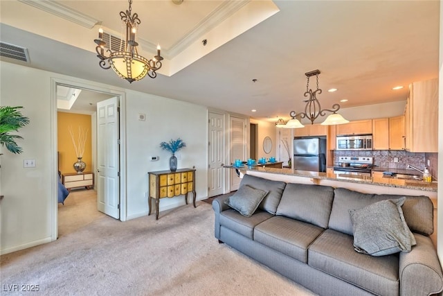 2405 W Serene Ave Unit 703, Las Vegas, NV 89123 - living area featuring light carpet, visible vents, recessed lighting, a notable chandelier, and crown molding
