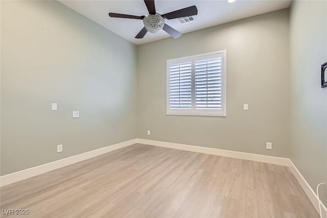 unfurnished room featuring ceiling fan, baseboards, visible vents, and light wood-type flooring