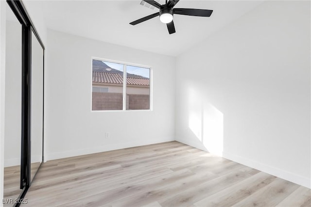unfurnished bedroom featuring light wood-type flooring, a closet, and ceiling fan
