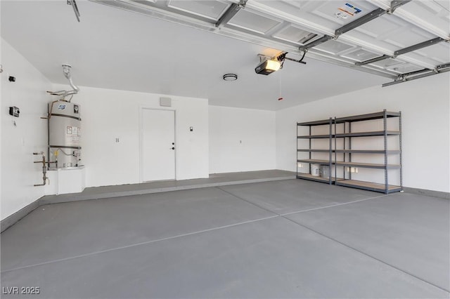 garage with a garage door opener and strapped water heater