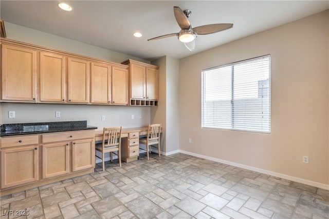 office space with recessed lighting, built in study area, stone finish floor, baseboards, and ceiling fan