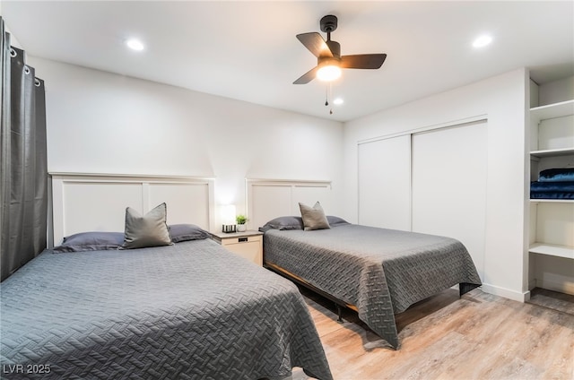 3120 S Eastern Ave Unit 5, Las Vegas, NV 89169 - bedroom featuring ceiling fan, a closet, recessed lighting, and light wood-style flooring