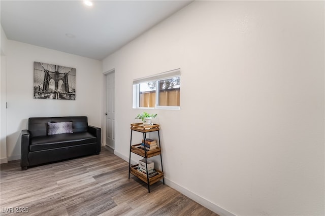 3120 S Eastern Ave Unit 5, Las Vegas, NV 89169 - sitting room with baseboards and wood finished floors