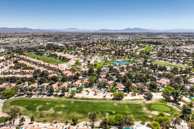 aerial view with a water and mountain view, a residential view, and view of golf course