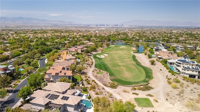 aerial view with a residential view, view of golf course, and a water and mountain view