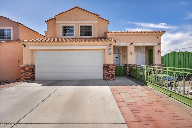 103 Trout Creek Ct, Las Vegas, NV 89123 - view of front of house featuring concrete driveway, stucco siding, a garage, and a tile roof
