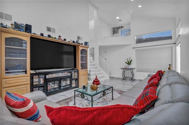 103 Trout Creek Ct, Las Vegas, NV 89123 - living area featuring marble tiled floors, high vaulted ceiling, stairway, recessed lighting, and baseboards