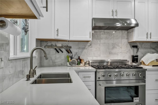 103 Trout Creek Ct, Las Vegas, NV 89123 - kitchen featuring stainless steel range, under cabinet range hood, white cabinets, and light countertops
