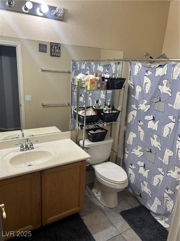 full bath with tile patterned flooring, toilet, vanity, and a shower with curtain