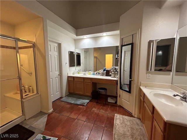 full bathroom featuring a shower stall, two vanities, and wood finished floors