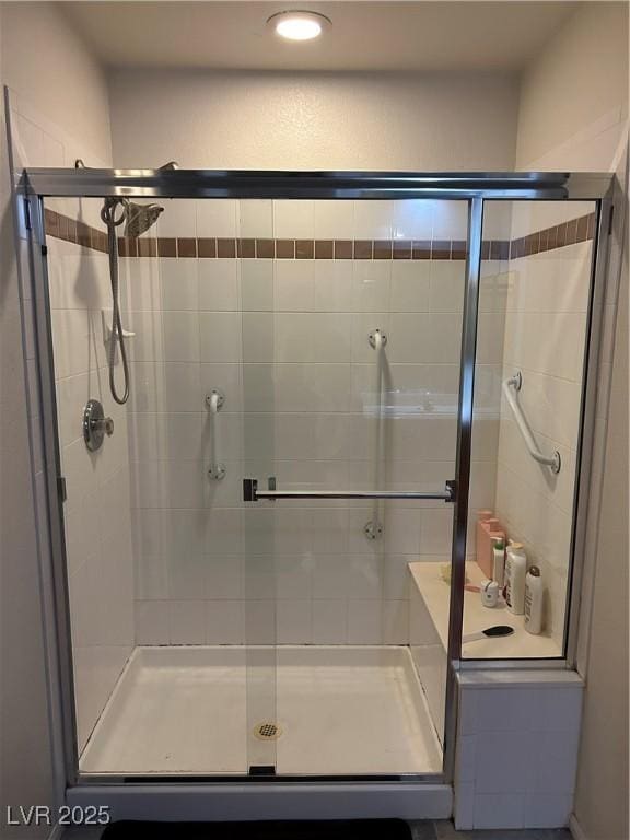 bathroom with a shower stall