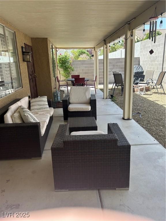 view of patio with outdoor lounge area, outdoor dining area, and a fenced backyard