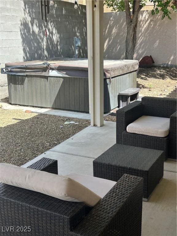 view of patio with a hot tub