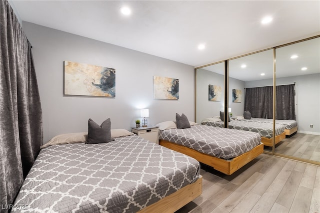 3120 S Eastern Ave Unit 6, Las Vegas, NV 89169 - bedroom featuring light wood-style floors, recessed lighting, and a closet