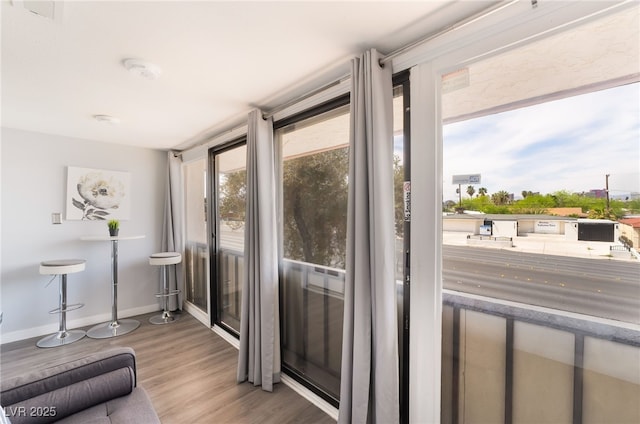 3120 S Eastern Ave Unit 6, Las Vegas, NV 89169 - entryway with baseboards and wood finished floors