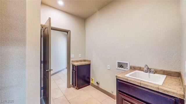 524 Blanche Ct, Henderson, NV 89052 - washroom with light tile patterned floors, electric dryer hookup, hookup for a washing machine, and a sink