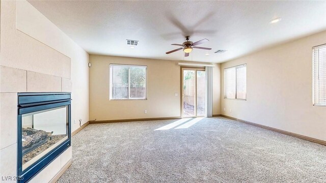 524 Blanche Ct, Henderson, NV 89052 - unfurnished living room with a ceiling fan, visible vents, light colored carpet, and baseboards