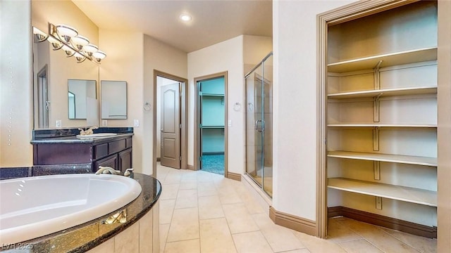 524 Blanche Ct, Henderson, NV 89052 - full bathroom with a garden tub, a shower stall, tile patterned flooring, and a walk in closet