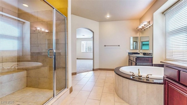 524 Blanche Ct, Henderson, NV 89052 - bathroom with a shower stall, vanity, a bath, baseboards, and tile patterned flooring