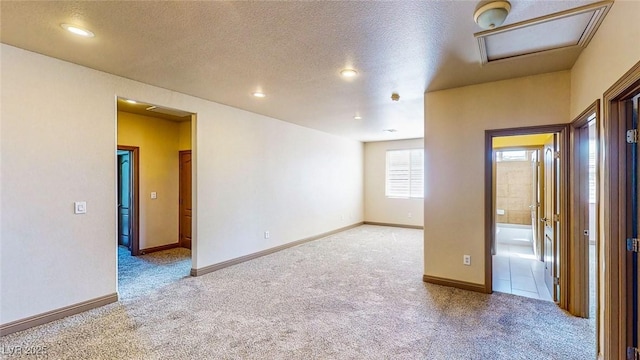 524 Blanche Ct, Henderson, NV 89052 - carpeted spare room with baseboards, recessed lighting, attic access, and a textured ceiling
