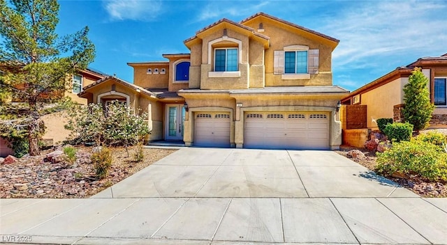 524 Blanche Ct, Henderson, NV 89052 - view of front facade featuring driveway, an attached garage, and stucco siding