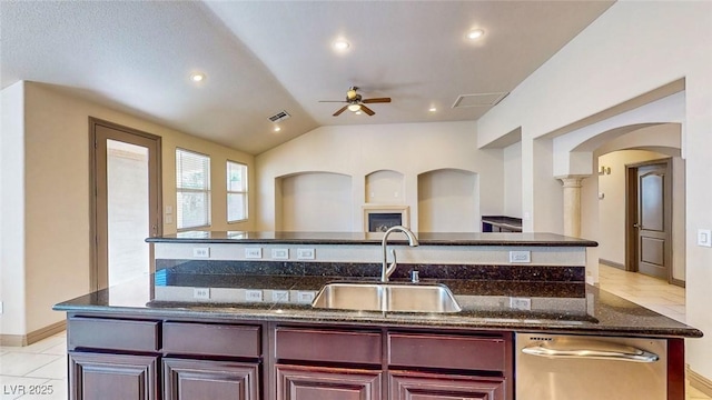 524 Blanche Ct, Henderson, NV 89052 - kitchen with arched walkways, dark brown cabinets, dishwasher, a sink, and a ceiling fan