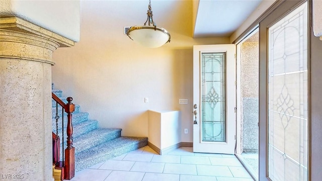 524 Blanche Ct, Henderson, NV 89052 - entryway featuring tile patterned flooring, stairs, and baseboards