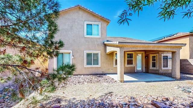 524 Blanche Ct, Henderson, NV 89052 - rear view of property with stucco siding and a patio