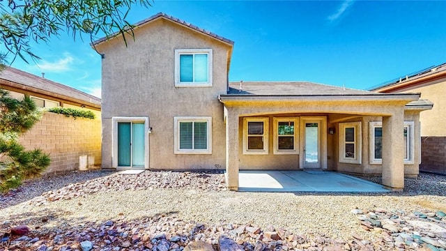 524 Blanche Ct, Henderson, NV 89052 - rear view of house with fence, stucco siding, and a patio area