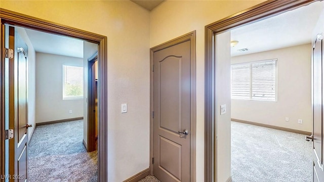 524 Blanche Ct, Henderson, NV 89052 - hallway featuring visible vents, carpet flooring, and baseboards
