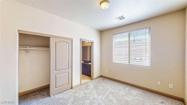 524 Blanche Ct, Henderson, NV 89052 - unfurnished bedroom with visible vents, ensuite bathroom, a closet, baseboards, and light carpet