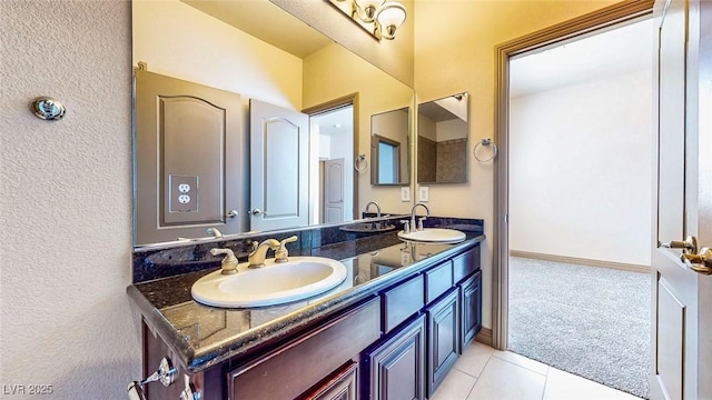 524 Blanche Ct, Henderson, NV 89052 - bathroom with double vanity, a textured wall, tile patterned flooring, and a sink