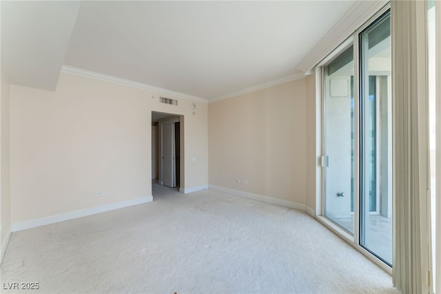 2877 Paradise Rd Unit 1806, Las Vegas, NV 89109 - empty room featuring light carpet, ornamental molding, baseboards, and healthy amount of natural light